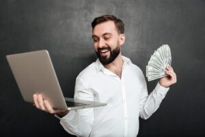 Portrait of successful businessman in white shirt holding fan of