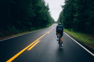 Cyclist man riding a bike on the road go to target for design or decorate cycling sport, business, finance, bangking