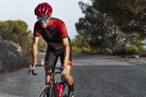 male-cyclist-training-with-bicycle-outdoors